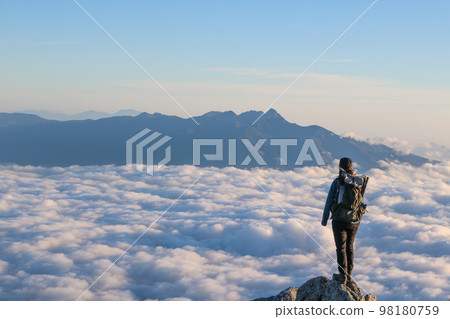 sea of clouds and woman 98180759