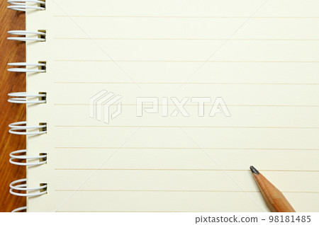 wood pencil on white notebook 98181485