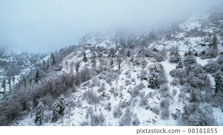 Cable car in the mountains in the winter forest 98181855