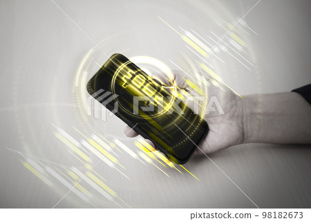 Bitcoin symbol hologram on mobile screen. Cryptocurrency and future technology concept. 98182673