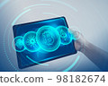Bitcoin, Ethereum, Cardano, Dogecoin, Binance Coin symbol hologram on tablet screen. Cryptocurrency and future technology concept. 98182674