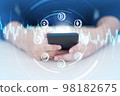 Hand using smart phone with Cryptocurrency coin symbol. Cryptocurrency and future technology. 98182675
