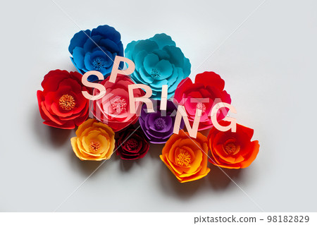 Handmade paper cutout flowers with spring lettering. Handmade paper cutout flowers with spring lettering. 98182829