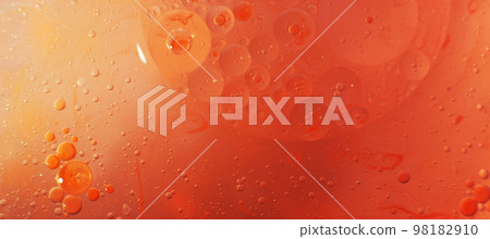 Gold and red Oil bubbles close up. circles of orange and pink water macro. abstract shiny background 98182910