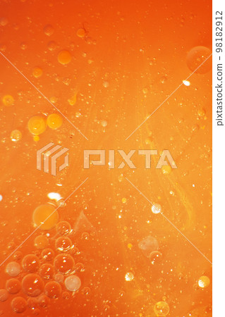 Gold Oil bubbles close up. circles of orange water macro. abstract shiny yellow background 98182912