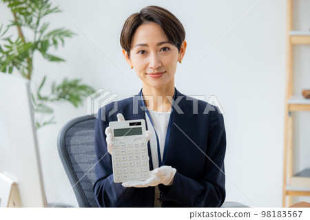 A woman appraising a watch A woman appraising a watch 98183567