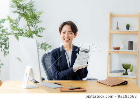 A woman appraising a watch A woman appraising a watch 98183568