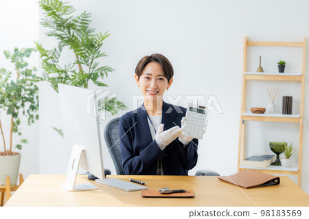 A woman appraising a watch 98183569