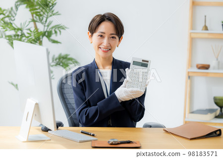 A woman appraising a watch 98183571