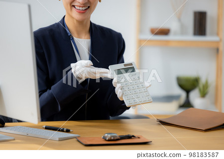 A woman appraising a watch 98183587