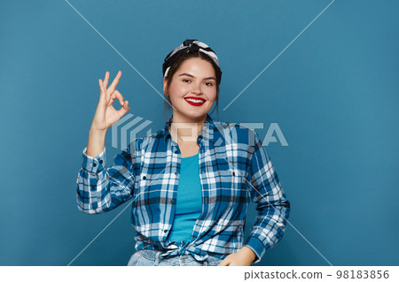 Smiling Woman Ok Gesture Isolated. Girl Standing and Showing Ok Sign Gesture Smiling Woman Ok Gesture Isolated. Girl Standing and Showing Ok Sign Gesture 98183856