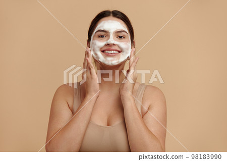 Cleaning Face. Smiling Full Figured Woman Cleaning Facial Skin with Foam Soap Cleaning Face. Smiling Full Figured Woman Cleaning Facial Skin with Foam Soap 98183990