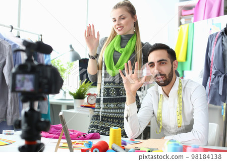 Man and woman bloggers designers shoot video on camera for stylist Man and woman bloggers designers shoot video on camera for stylist 98184138