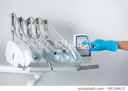 Different dental instruments and tools in a dentists office Different dental instruments and tools in a dentists office 98184623