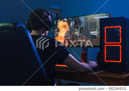 professional gamer playing tournaments online video games on computer professional gamer playing tournaments online video games on computer 98184810