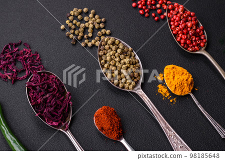 Several types of spices in metal spoons paprika, tomatoes, curry, beets, cumin, turmeric, fennel, spirulina Several types of spices in metal spoons paprika, tomatoes, curry, beets, cumin, turmeric, fennel, spirulina 98185648