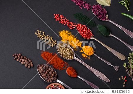 Several types of spices in metal spoons paprika, tomatoes, curry, beets, cumin, turmeric, fennel, spirulina Several types of spices in metal spoons paprika, tomatoes, curry, beets, cumin, turmeric, fennel, spirulina 98185655