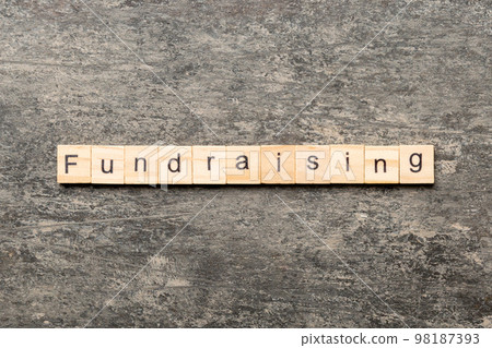 fundraising word written on wood block. fundraising text on table, concept fundraising word written on wood block. fundraising text on table, concept 98187393