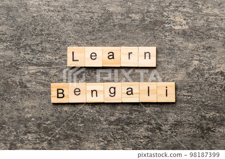 learn Bengali word written on wood block. learn Bengali text on table, concept 98187399