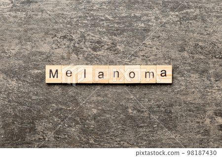 melanoma word written on wood block. melanoma text on table, concept 98187430