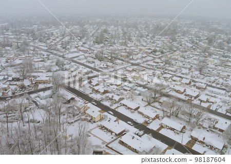 Spectacular aerial view of small American home town after snowfall during severe winter in South Carolina US 98187604