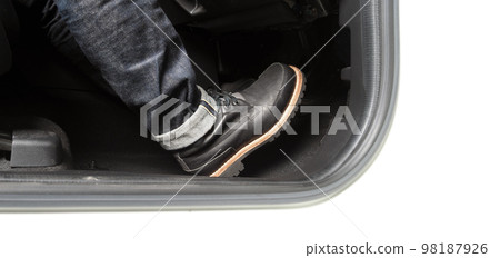 Car accelerate and brake foot pedal. Close up foot press or push foot break and accelerate pedal of a car to drive ahead. Driver driving the car by pressing or pushing accelerator pedals of the car. 98187926