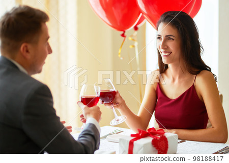 Valentine's Day concept. Happy couple in love. Couple celebrating Valentine's Day in restaurant. Valentine's Day concept. Happy couple in love. Couple celebrating Valentine's Day in restaurant. 98188417