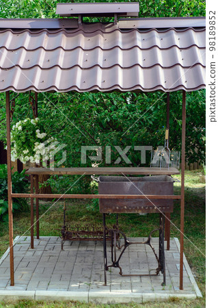 specially equipped place for barbecue in the courtyard of a vill 98189852