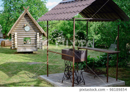 specially equipped place for barbecue and wooden hut in the cour 98189854