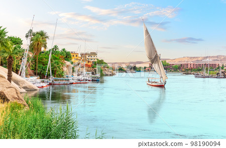 Traditional felucca in the Nile river, Aswan, Egypt, beautiful summer scenery Traditional felucca in the Nile river, Aswan, Egypt, beautiful summer scenery 98190094