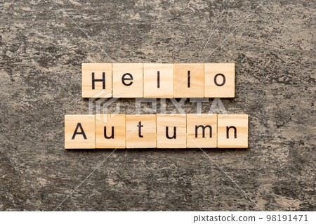 hello autumn word written on wood block. hello autumn text on cement table for your desing, concept 98191471