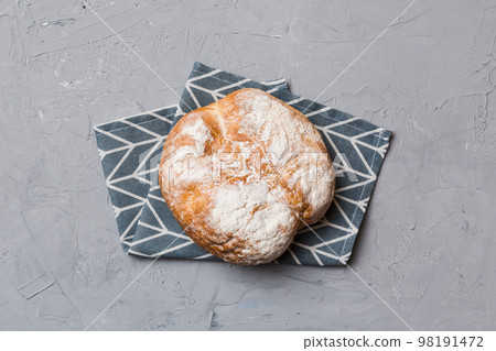 Fresh homemade crisp round bread on napkin, top view. Healthy unleavened bread. French bread. Top view Bakery products Fresh homemade crisp round bread on napkin, top view. Healthy unleavened bread. French bread. Top view Bakery products 98191472