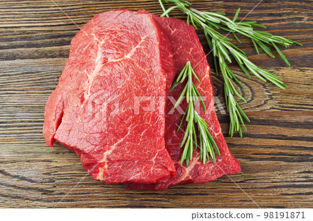 Fresh raw meat with rosemary Fresh raw meat with rosemary 98191871