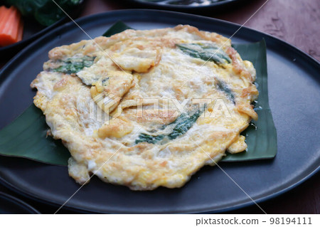 omelette, omelet or fried egg with tea leaf or fried egg with vegetable omelette, omelet or fried egg with tea leaf or fried egg with vegetable 98194111