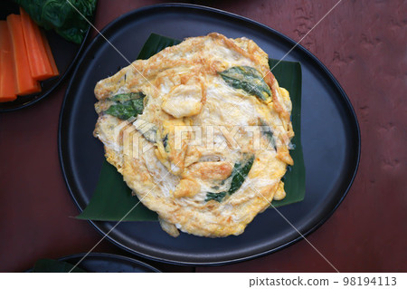 omelette, omelet or fried egg with tea leaf or fried egg with vegetable omelette, omelet or fried egg with tea leaf or fried egg with vegetable 98194113