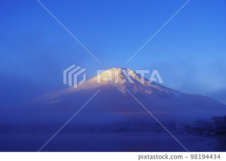 Mt.Fuji in early morning covered in morning mist 98194434