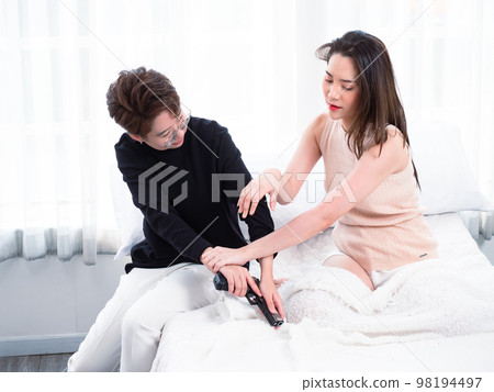 Troubled Asian beautiful lesbian couple snatching guns in the bedroom. married life is not smooth, the gun problem, unhappy Asian girls fighting angry. 98194497