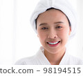 Home spa. Girl felling relaxing and enjoy time on the bed at the home spa. 98194515
