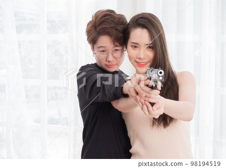 Young Asia LGBT teaches her girlfriend the backslider how to handle a weapon, firearm training at a firing range, in the bedroom Young Asia LGBT teaches her girlfriend the backslider how to handle a weapon, firearm training at a firing range, in the bedroom 98194519