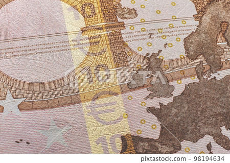 closeup of a European currency seal, with a hologram and various other security features visible. The seal is designed to be tamper-proof, making it difficult for counterfeits to be produced 98194634