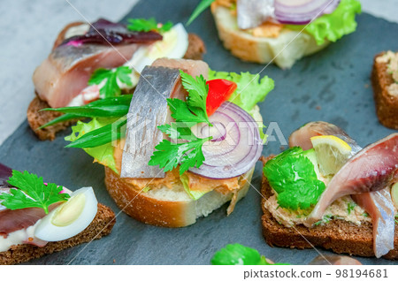 Appetizer with salted herring. Appetizer with salted herring. 98194681