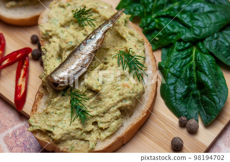 Sandwich with fish pate and sprats. 98194702