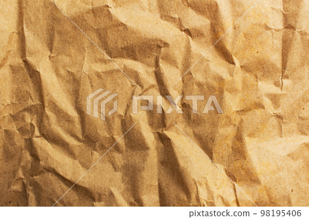 Rumpled brown cardboard paper texture background with copy space 98195406