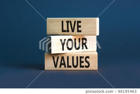 Live your values symbol. Concept words Live your values on wooden blocks. Beautiful grey table grey background. Business, psychological and live your values concept. Copy space. 98195463