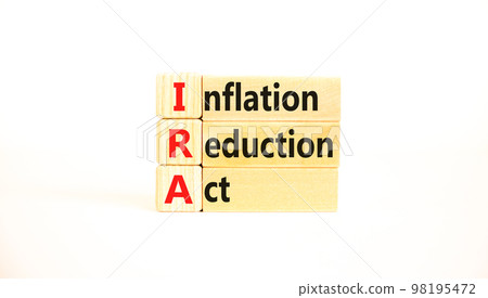 IRA inflation reduction act symbol. Concept words IRA inflation reduction act on wooden blocks on a beautiful white table white background. Business IRA inflation reduction act concept. Copy space. IRA inflation reduction act symbol. Concept words IRA inflation reduction act on wooden blocks on a beautiful white table white background. Business IRA inflation reduction act concept. Copy space. 98195472