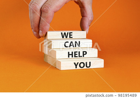 Support and we can help you symbol. Concept words We can help you on wooden blocks. Beautiful orange background. Businessman hand. Business psychological we can help you concept. Copy space. 98195489