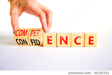 Competence and confidence symbol. Concept word Competence Confidence on wooden cubes. Businessman hand. Beautiful white table white background. Business competence confidence concept. Copy space. 98195501