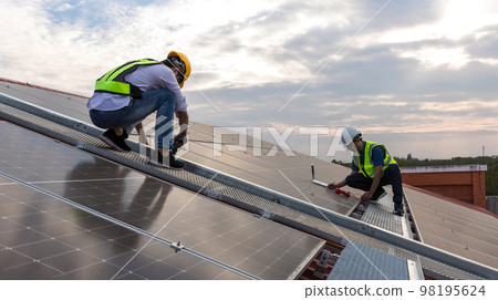 Engineer working setup Solar panel at the roof top. Engineer working setup Solar panel at the roof top. 98195624