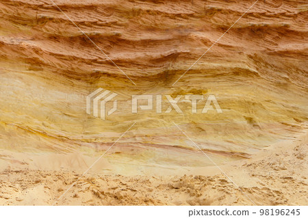 sand layers structure. sedimentary rock-sandstone. Surface of wall. industrial quarry. opencast mining. 98196245