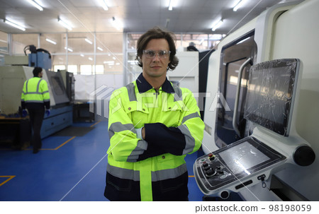 Supervisor  Engineer Working with big machine 98198059